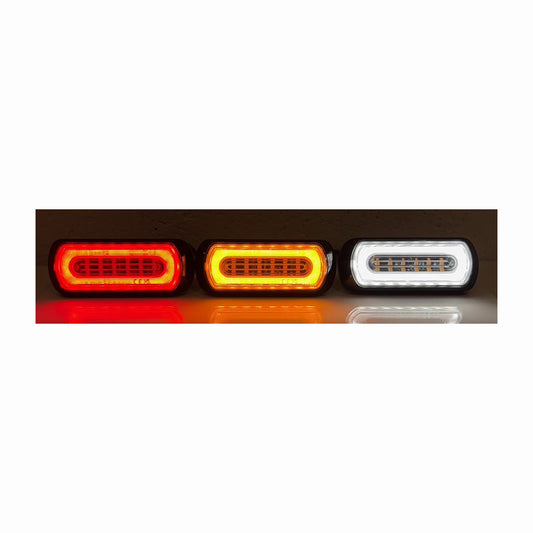 Three LED tail lights in red, orange, and white on a white background