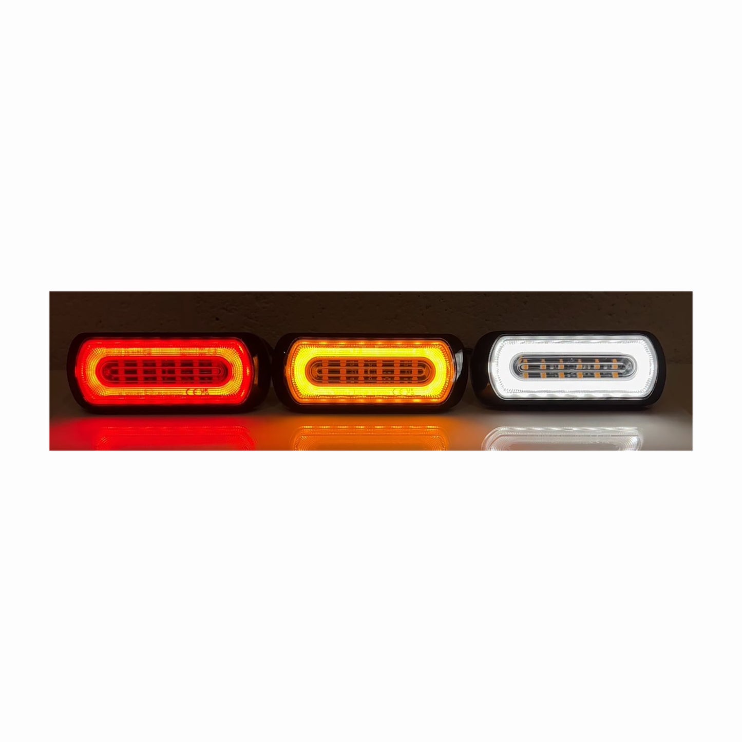 Three LED tail lights in red, orange, and white on a white background