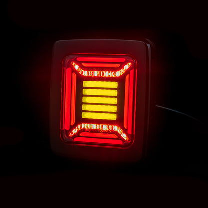 Red and yellow Horpol CUBE Rear Combination Lamp LED light on a black background
