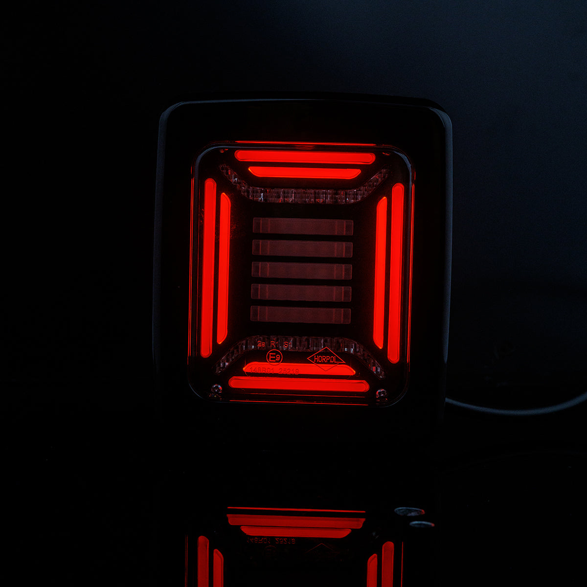 Red LED light Horpol CUBE Rear Combination Lamp on a black background