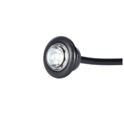 Small round light with black casing on a white background