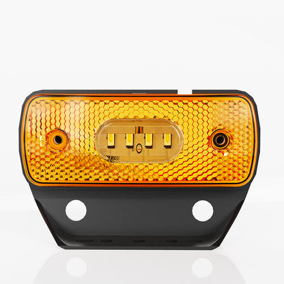 Amber reflective traffic safety light on a white background