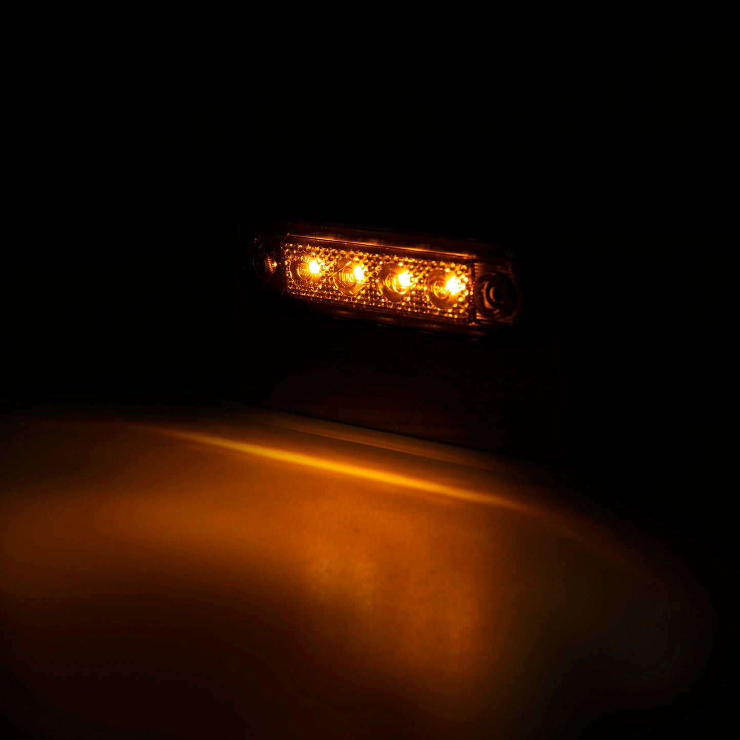 Amber LED light bar on a dark background