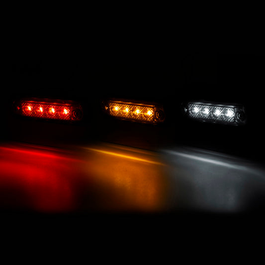 Three LED lights in red, yellow, and white on a dark background