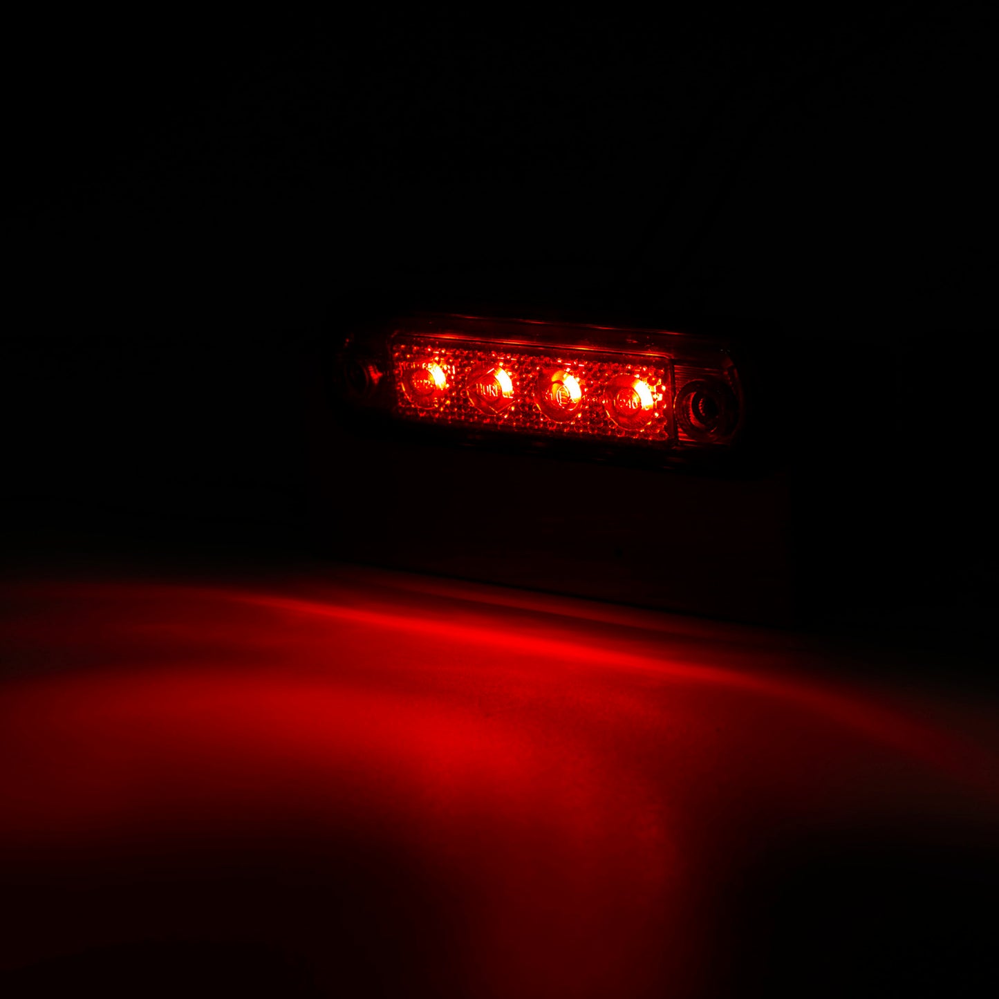 Red LED light on a dark background