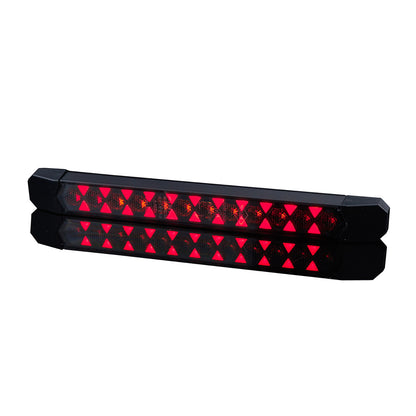 Pair of red LED lights with black casing on a white background