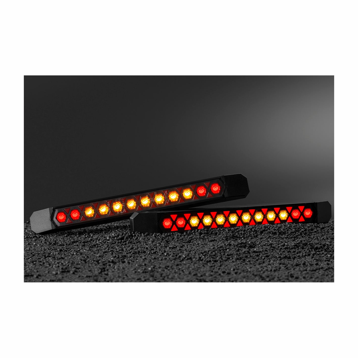 Two LED strip lights with red and yellow LEDs on a black background